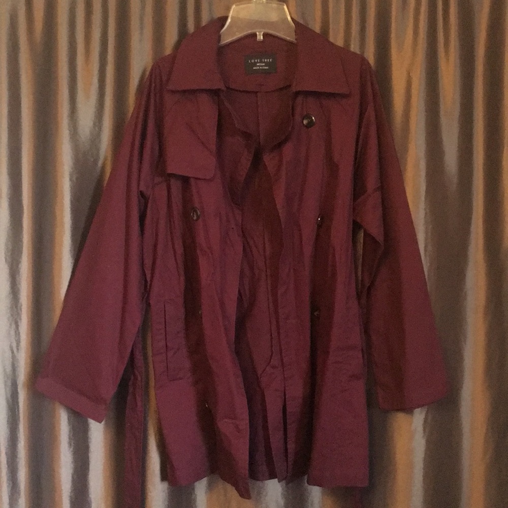 Burgundy colored light trench coat